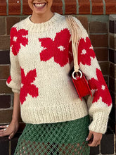 Suéter floral de cuello redondo que combina con todo